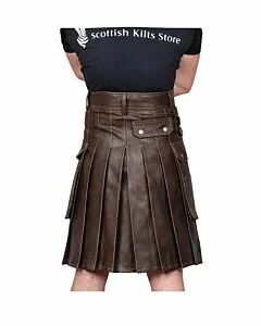 Brown leather utility kilt featuring rugged design with metal studs and adjustable straps
