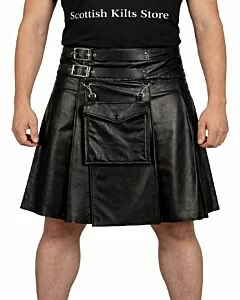 Black leather gothic utility kilt with adjustable straps and metal buckles, front view showing rugged design and deep utility pockets