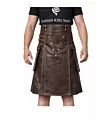 Brown leather utility kilt featuring rugged design with metal studs and adjustable straps