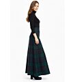 right Side view of Black Watch Tartan Maxi Skirt with flowing maxi design